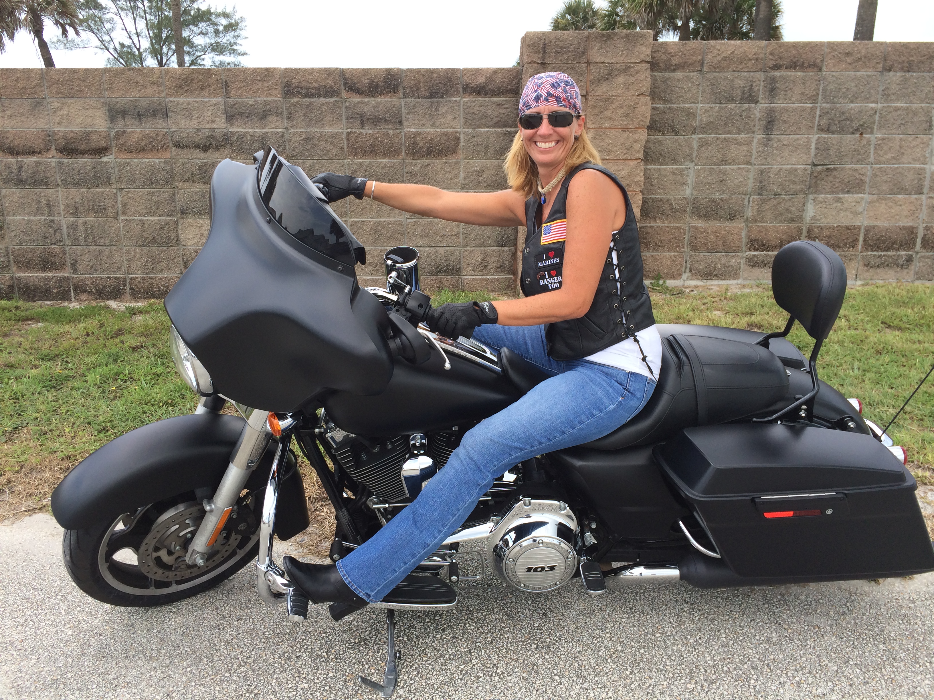 Sexy girl on a Harley Davidson at the surf beach
